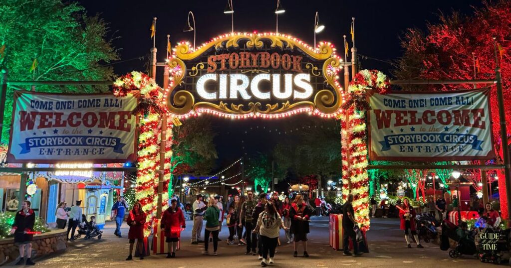 Storybook Circus entrance arch lit red and green for the Christmas party, home of Santa's Christmas Carnival